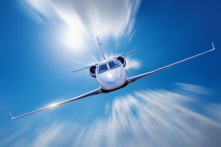 Private jet with high speed into the cloudsの写真素材