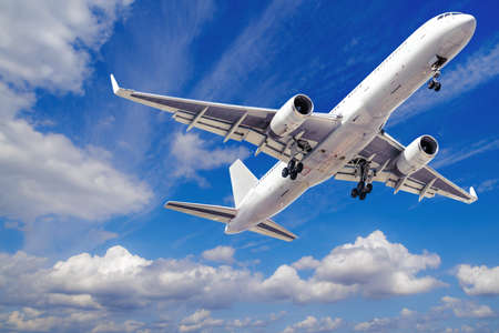 modern airliner takes off into a blue skyの写真素材