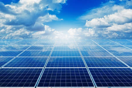 solar panels against a blue skyの写真素材