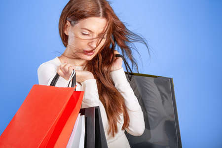 young woman with shopping bagsの写真素材