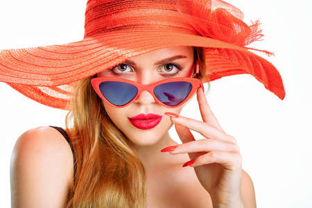 young beauty with a straw hat and sun glassesの写真素材