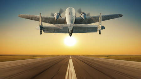 landing of an historical aircraft against a sunsetの写真素材