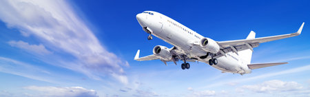 modern airliner against a blue skyの写真素材