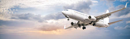 modern airliner against a blue skyの写真素材
