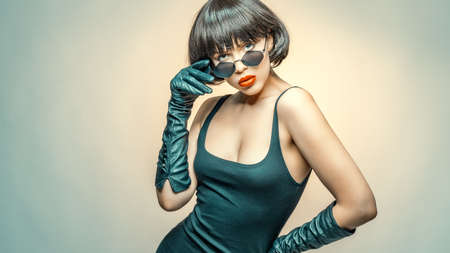 young beauty with sunglasses and glovesの写真素材
