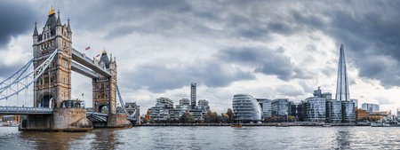 the famous tower bridge of london against a dramatic skyの写真素材