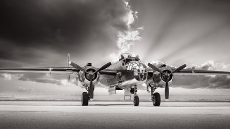historical bomber plane on a runwayの写真素材