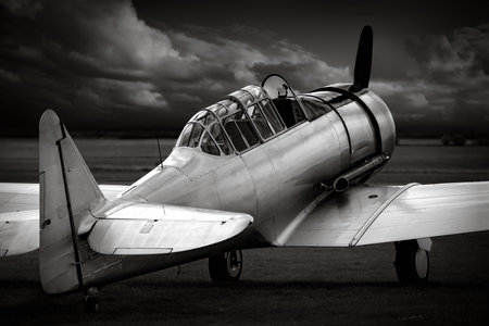historical aircraft against a dark skyの写真素材