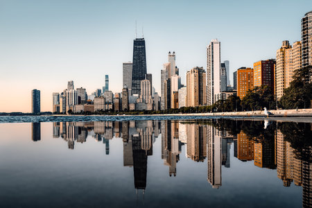 The reflected skyline of Chicago during sunriseの写真素材
