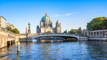 the famous berlin cathedral under a blue skyの写真素材
