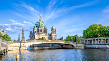the famous berlin cathedral under a blue skyの写真素材