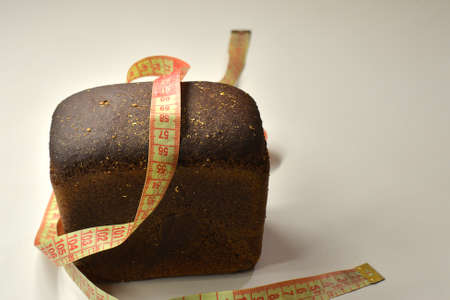Healthy breakfast, homemade granola or muesli with oat flakes, toasted peanuts, red and black currant, blackberry in a bowl and a bottle of fresh milk on a wooden rustic table, selective focusの写真素材