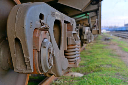 Close-ups Steel diesel railcar train bogie wheels on the tracks.の写真素材