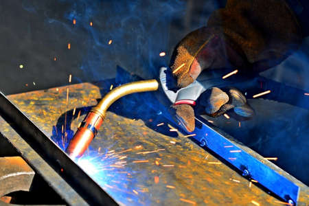 Industrial steel welder in factory