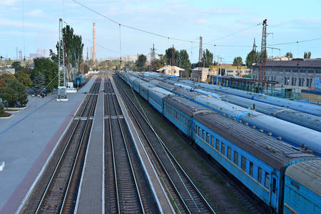Railway station on the background of blue sky at sunrise with motion blur effect in vintage style....