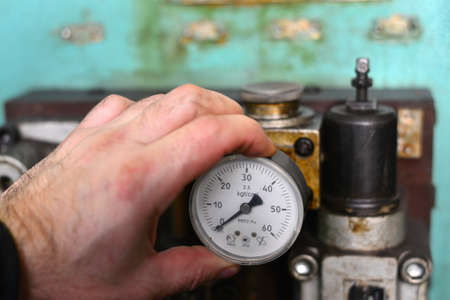 worker press start button on panel control for start CNC machineの写真素材