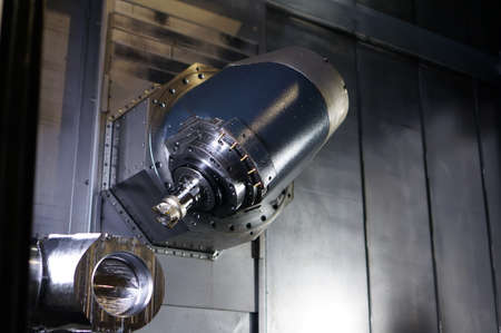 The CNC lathe machine or Turning machine drilling the metal rod with the drill tool and center drill...