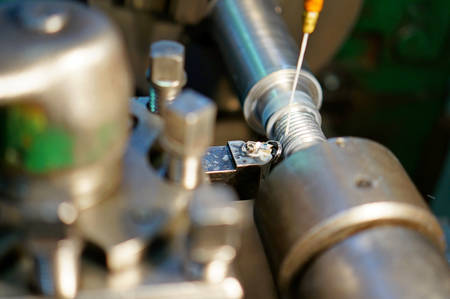 Technicians are turning lathe with horizontal lathe machine.の写真素材