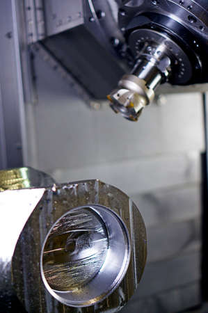 The CNC lathe machine or Turning machine drilling the metal rod with the drill tool and center drill...