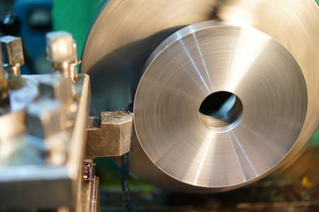 Technicians are turning lathe with horizontal lathe machine.