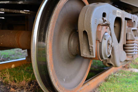 Close-ups Steel diesel railcar train bogie wheels on the tracks.の写真素材