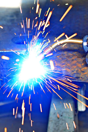 Industrial Worker labourer at the factory welding steel structureの写真素材