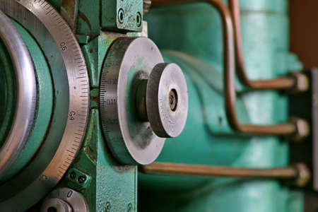 metalworking machining industry. finishing or grinding metal surface on grinder machine at factoryの写真素材