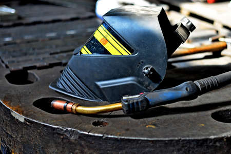 Industrial Worker labourer at the factory welding steel structure