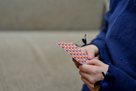 Small child taking medicineの写真素材