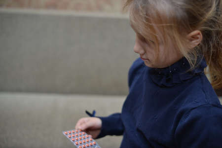 Small child taking medicineの写真素材