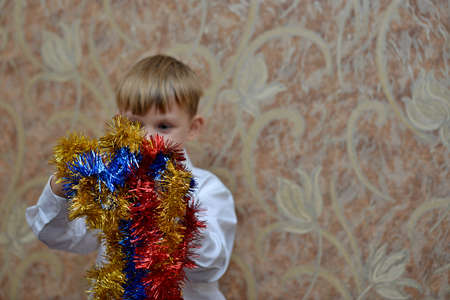Funny children keep buhirb for Christmas and New Yearの写真素材