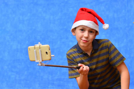 Santa Claus with kids indoors christmas celebration conceptの写真素材