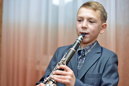 Boy playing the clarinetの写真素材