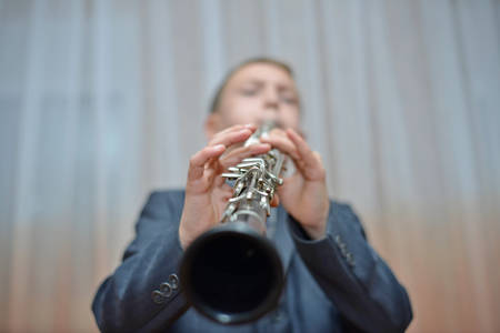 Boy playing the clarinetの写真素材