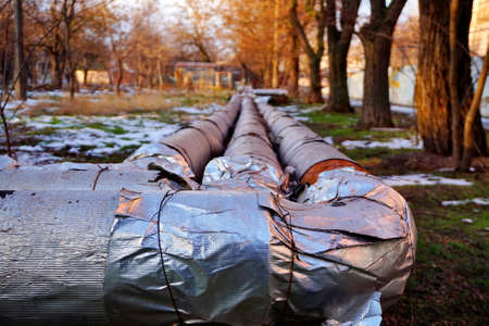Street heating main. Heating pipes on the street in poor condition.の写真素材