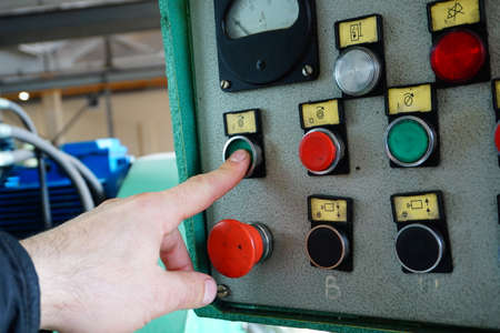 The operator switches the control mechanisms on the machine to the control panel.の写真素材