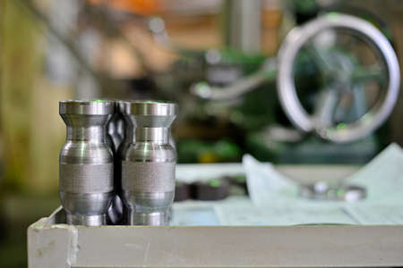 Turning products from metal on the rack against the background of the machine. Details with a notch on the side.の写真素材