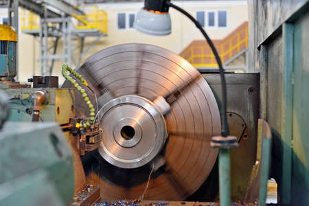 The metal part is machined on a latheの写真素材