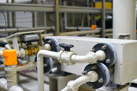 The shop for the production and processing of hydraulic equipment from plastic pipes under pressure at the oil station.の写真素材