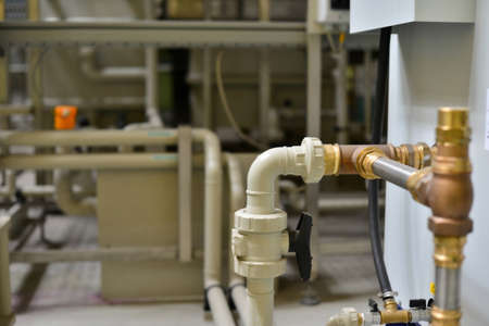 Brass, metal and plastic pipe joints under pressure at the station.