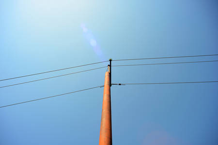 Electric post with wires to the streetの写真素材