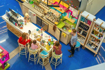 Mariupol, Ukraine, May 26, 2018: Cafe with visitors in the shopping center. View from above.のeditorial素材