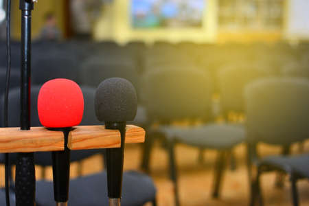 Microphone over the blurred business conference hall or seminar room, Blurred backgroundの写真素材