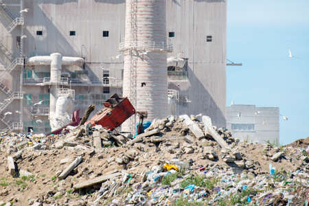 Smoke from pipes in the plant, polluting the environment. Dirty air in the sky.の写真素材