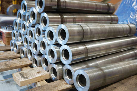 Round iron parts after turning and milling processing are located in the factory