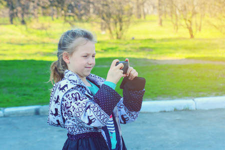 Girl takes pictures on phone