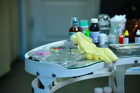 Medical glove with medicines in the hospital at the dentist on the medical table.の写真素材