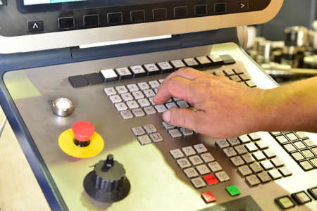 The control panel of the program of work on the control panel of the precision CNC machining center, the processing of the manufacturing process of the metal product at the factoryの写真素材