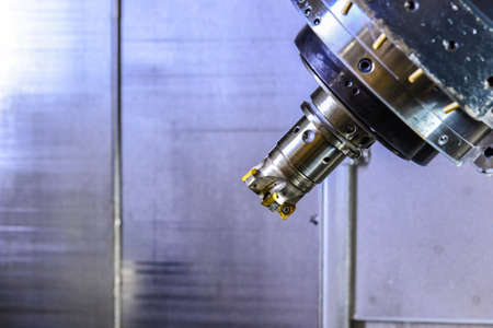 CNC Router and turning metal with a cutting tool and centering tool. The concept of high-tech processingの写真素材