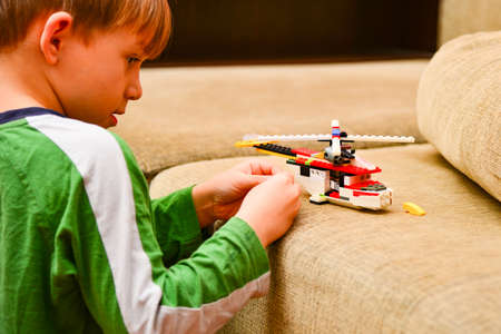 The boy plays the designer, the child collects the designer at home.の写真素材